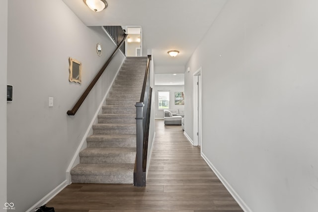 10797 Walden Ln, Brownsburg, IN 46112 - staircase featuring wood finished floors and baseboards