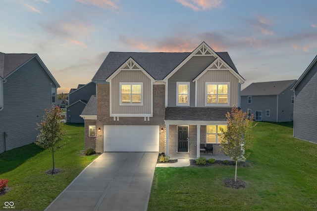 craftsman inspired home featuring a lawn and a garage