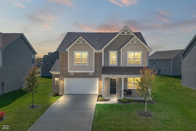 10797 Walden Ln, Brownsburg, IN 46112 - craftsman-style home featuring an attached garage, concrete driveway, brick siding, and a yard