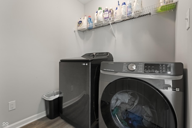 10797 Walden Ln, Brownsburg, IN 46112 - washroom with washing machine and dryer, wood finished floors, and baseboards