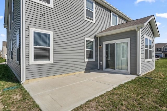 10797 Walden Ln, Brownsburg, IN 46112 - rear view of house featuring a patio area and a lawn
