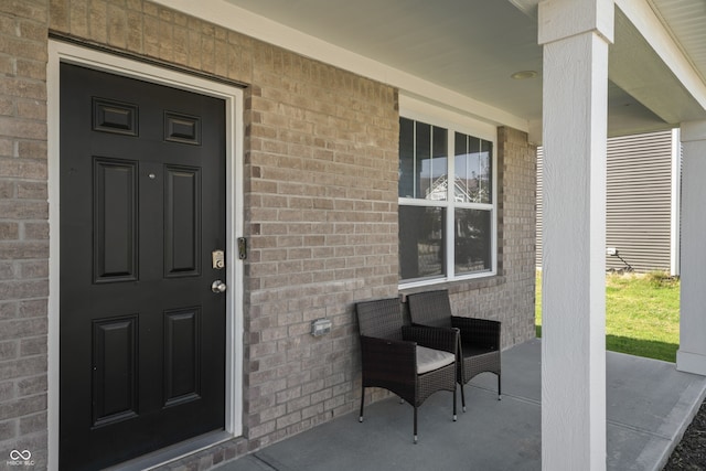 doorway to property with a porch