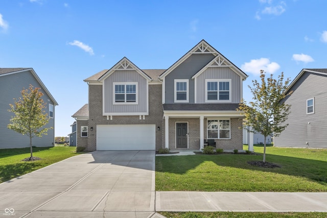 10797 Walden Ln, Brownsburg, IN 46112 - craftsman inspired home with concrete driveway, a garage, brick siding, and a front lawn