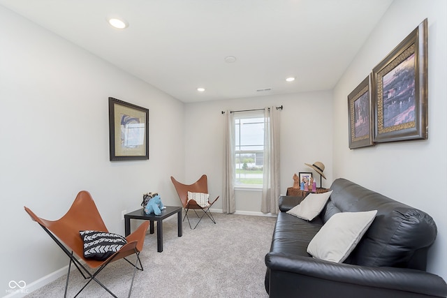 living area with light colored carpet