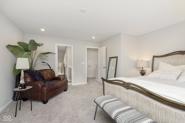 carpeted bedroom featuring ensuite bath