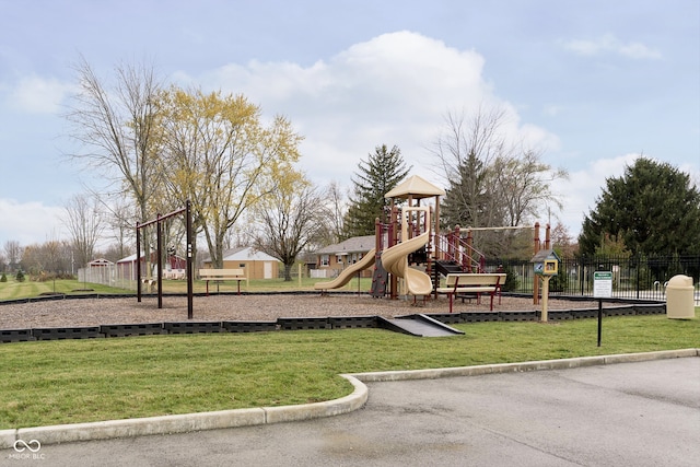 view of jungle gym with a lawn