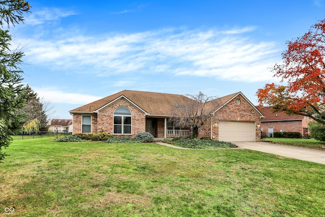 single story home featuring a front yard and a garage