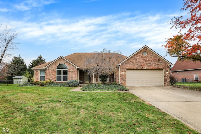 ranch-style home featuring a garage and a front yard