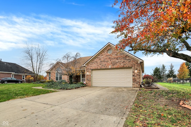 view of front of house with a front lawn and a garage