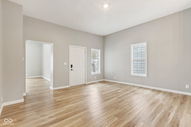 unfurnished room with light hardwood / wood-style floors