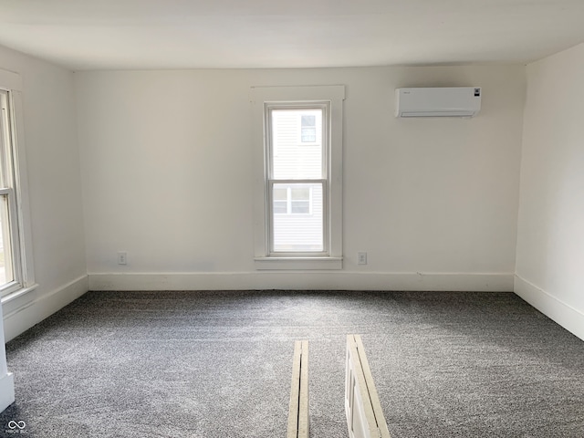 carpeted empty room with a wall mounted AC