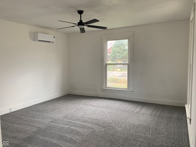 carpeted spare room featuring an AC wall unit and ceiling fan