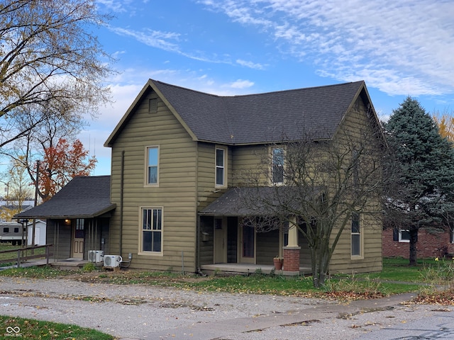 front of property featuring ac unit and a porch