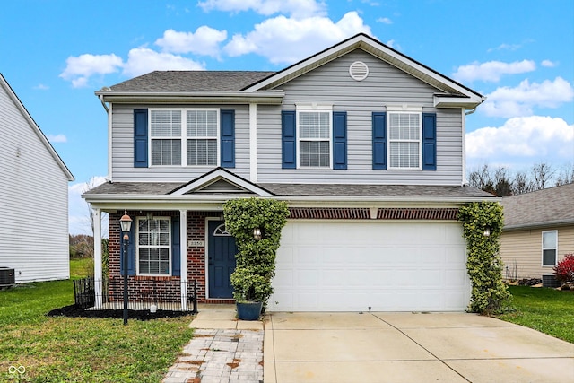 front facade featuring cooling unit, a garage, and a front lawn