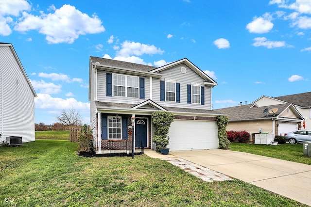 view of front property with a front lawn, a garage, and central AC