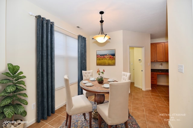 tiled dining area with built in desk