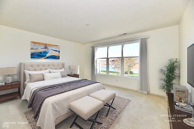 bedroom with light colored carpet