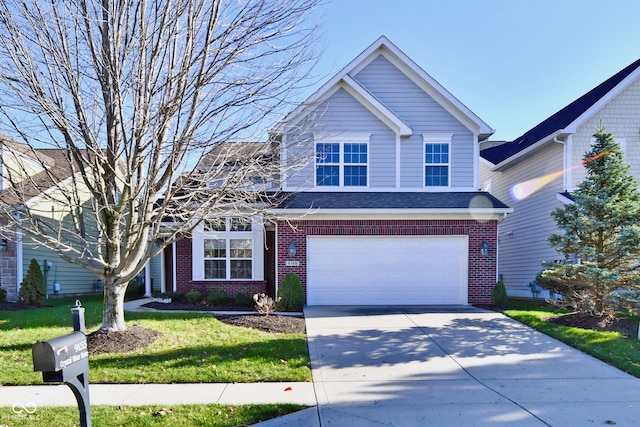 view of front of property with a front lawn and a garage