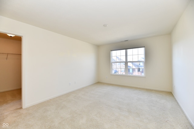 empty room featuring light colored carpet