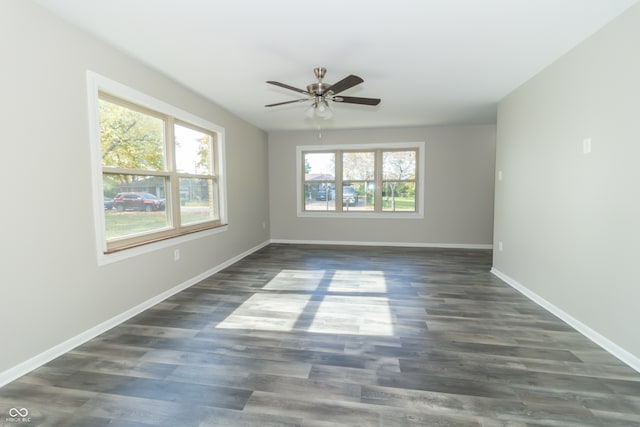 unfurnished room featuring ceiling fan and dark hardwood / wood-style floors