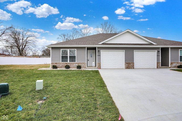 view of front facade with a garage and a front yard