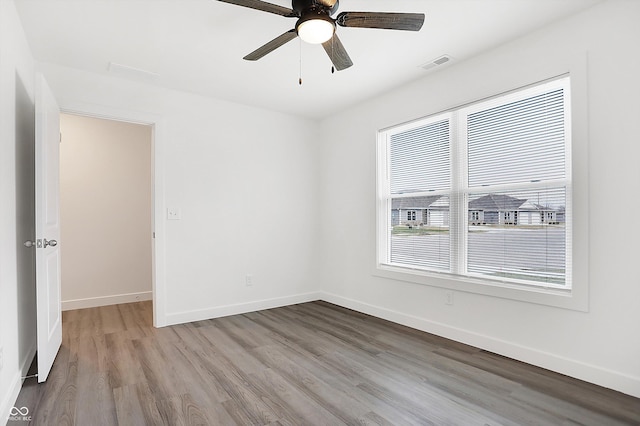 unfurnished room with ceiling fan and light hardwood / wood-style floors