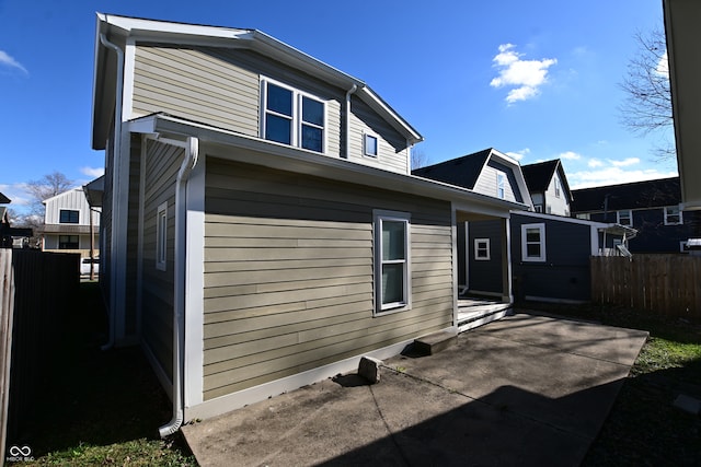 rear view of property featuring a patio