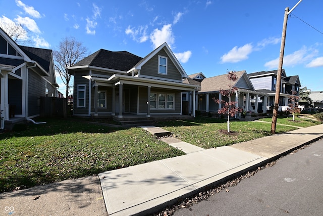 view of front facade with a front lawn and covered porch