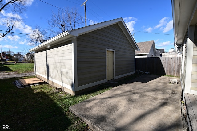 view of outbuilding with a lawn