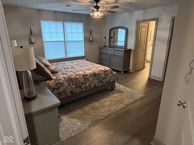 bedroom featuring ceiling fan and dark hardwood / wood-style flooring