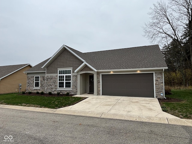 view of front facade with a front yard and a garage