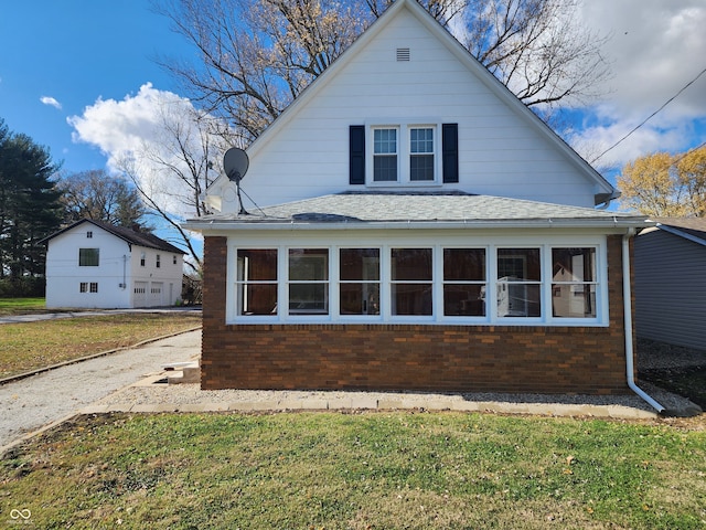 view of home's exterior featuring a lawn