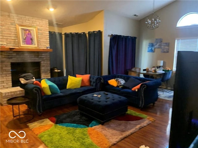 living room featuring dark hardwood / wood-style floors, a fireplace, and high vaulted ceiling