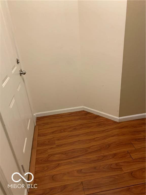 unfurnished room featuring hardwood / wood-style flooring