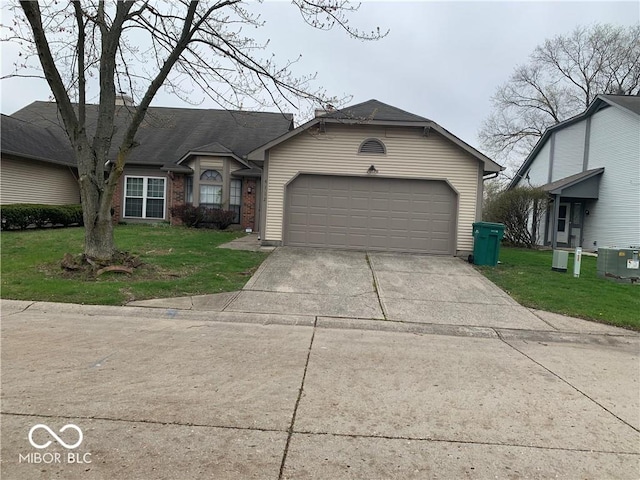 view of front of home with central air condition unit, a front yard, and a garage