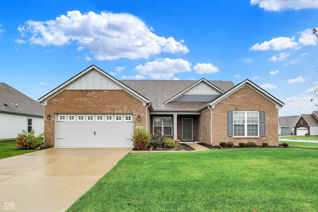 view of front of home with a garage and a front yard