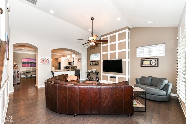 living room with ceiling fan, high vaulted ceiling, and dark hardwood / wood-style floors