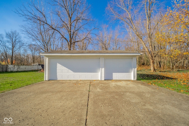 garage featuring a lawn