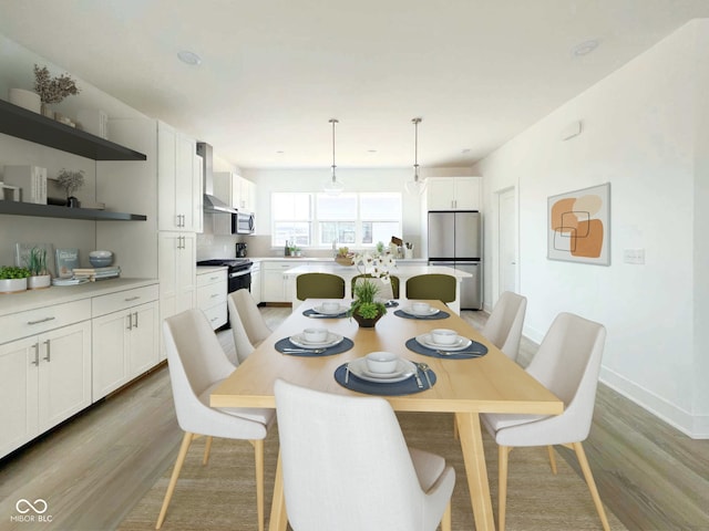 dining space with light hardwood / wood-style floors