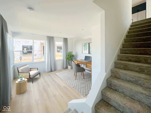 staircase featuring hardwood / wood-style floors