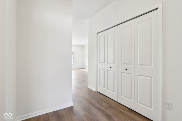 hallway with wood-type flooring