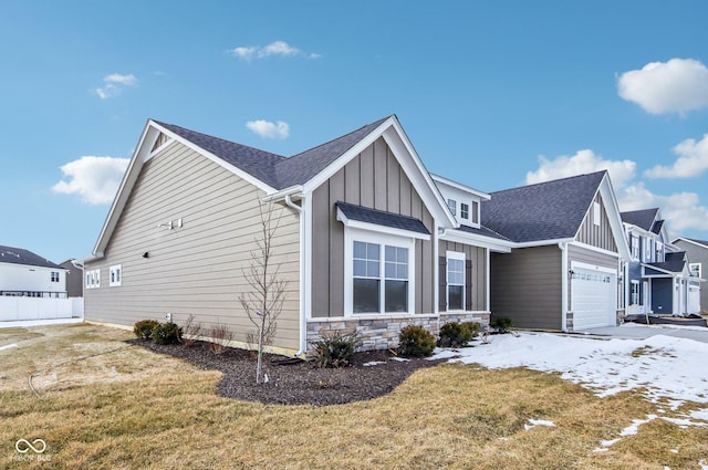 view of home's exterior featuring a garage and a lawn