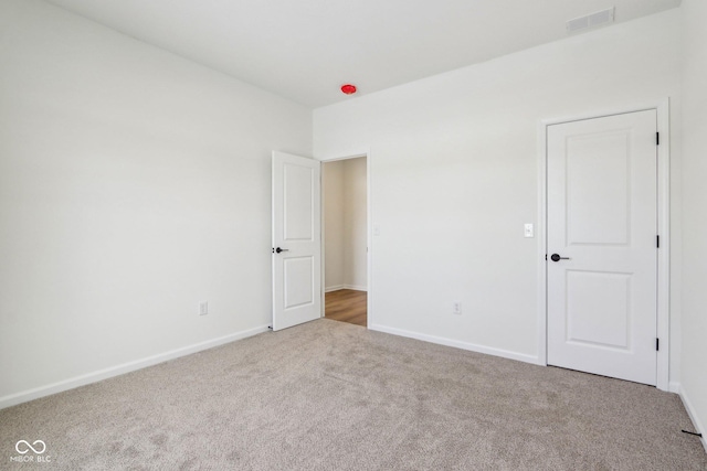 spare room with carpet floors