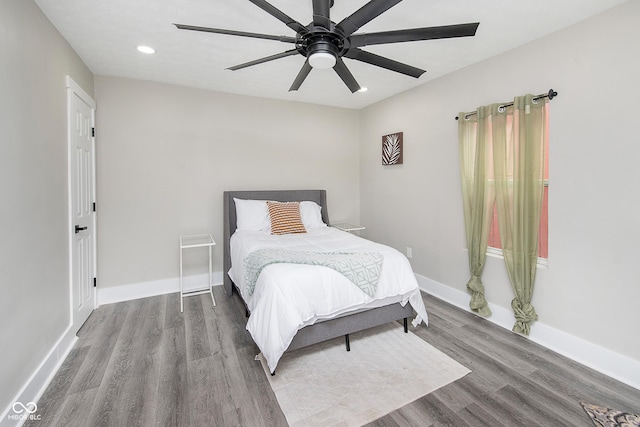 bedroom with hardwood / wood-style floors and ceiling fan