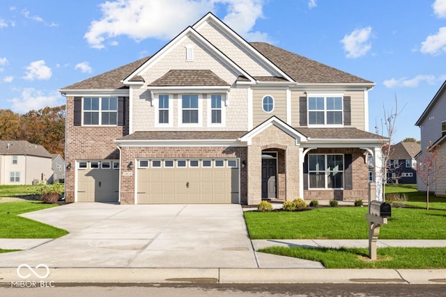 craftsman inspired home with a garage and a front lawn