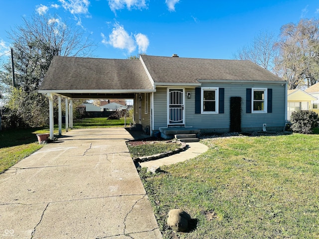 ranch-style home with a carport and a front yard