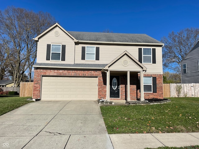 front of property with a front yard and a garage