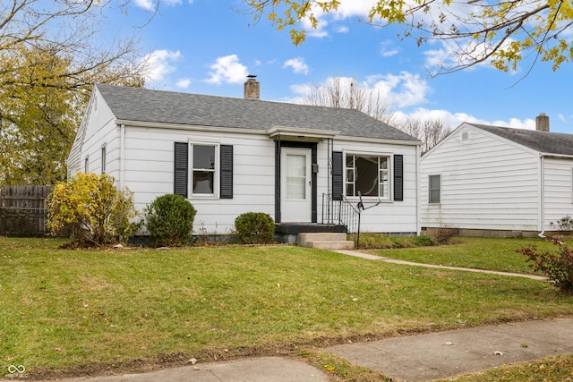 view of front of home with a front lawn