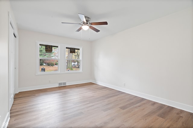 unfurnished room featuring ceiling fan and light wood-type flooring