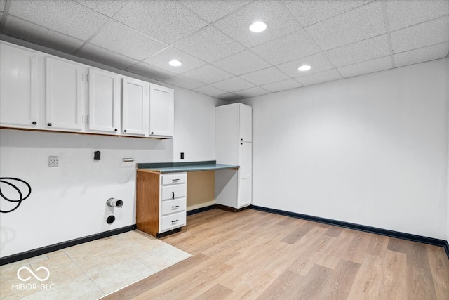 clothes washing area with hookup for a washing machine and light hardwood / wood-style floors